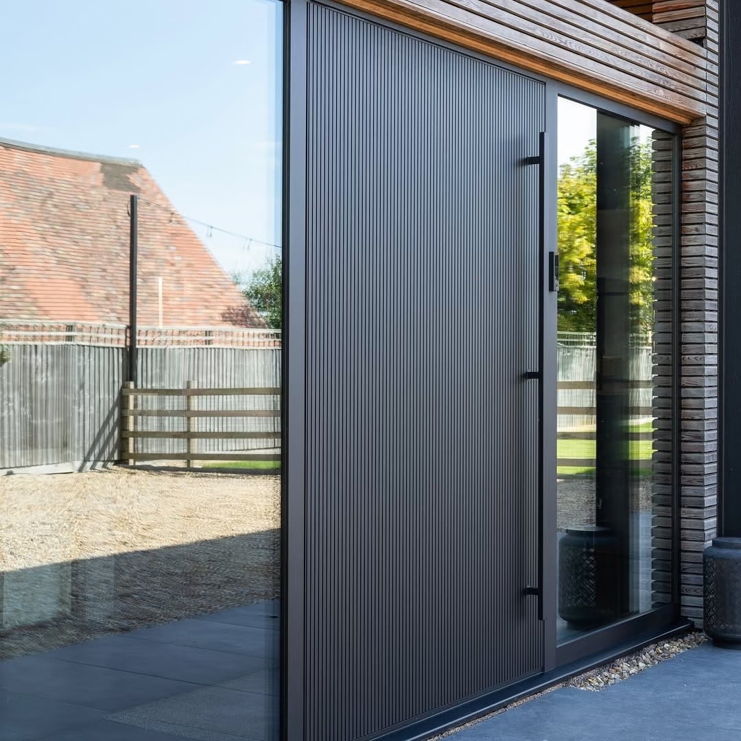 TINNO Vertical Fluted Sliding Entry Doors | Industrial Minimalism for Modern Res